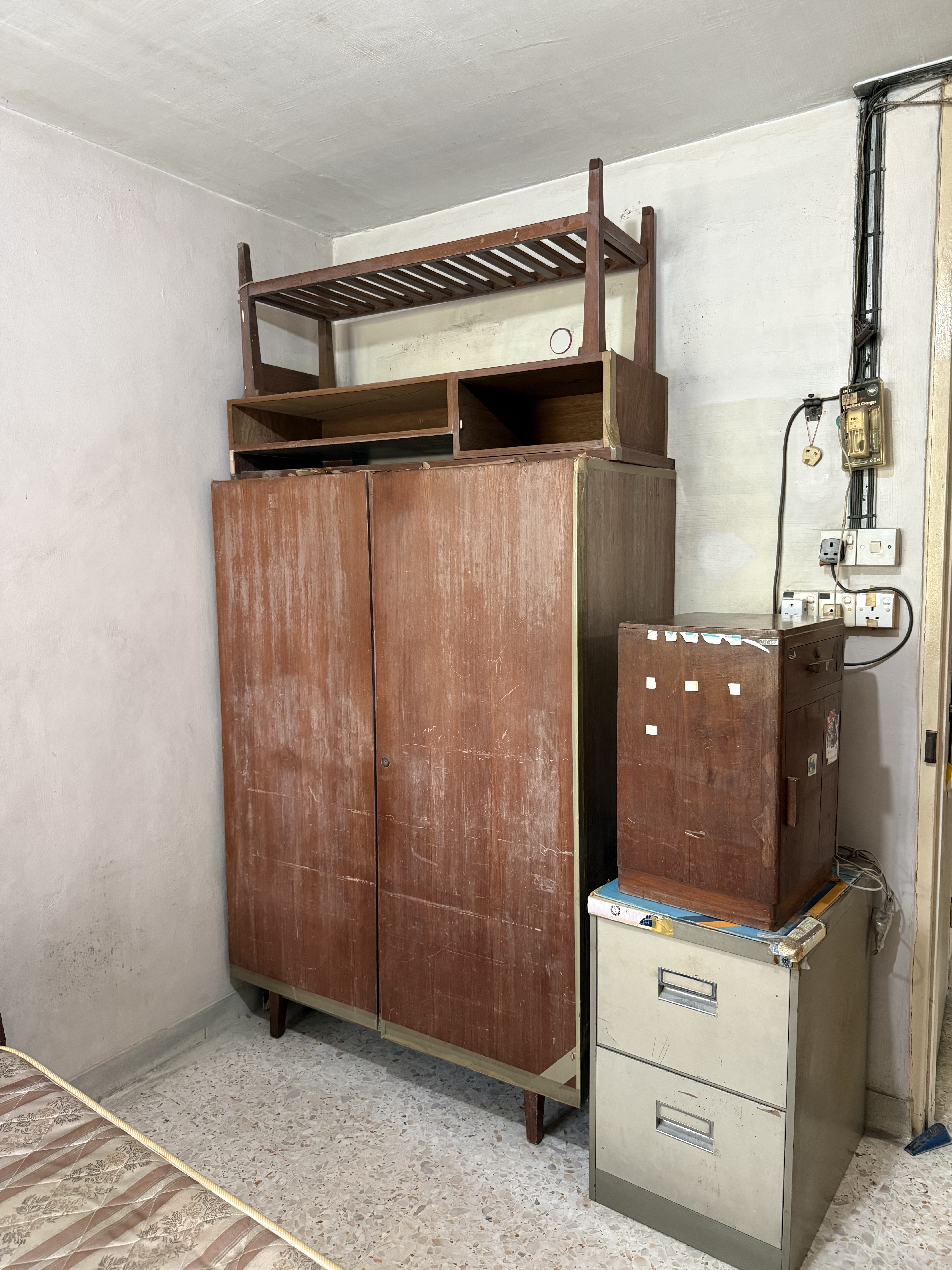 Old wooden wardrobe and filing cabinet cleared from a residential unit in Ang Mo Kio.